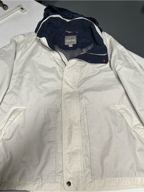 Pacific Trail Hooded Rain jacket with Navy Lining and hood rolled into collar